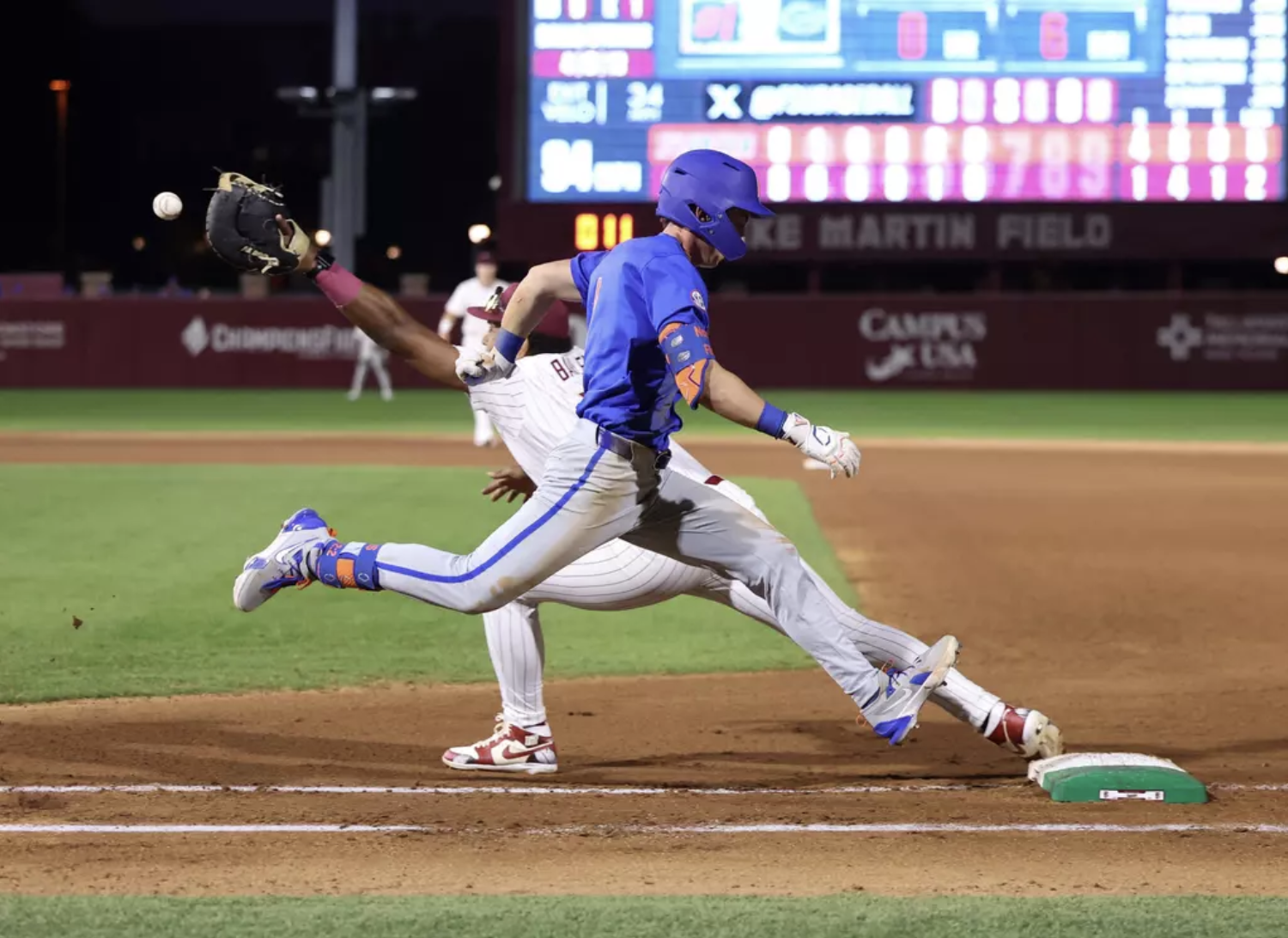 UF junior Justin Nadeau sprints to first base during the baseball game against the Seminoles in Tallahassee on March 11, 2025.